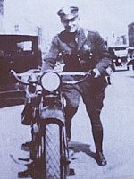 Chief Bill Vosburgh stands next to his 1926 Indian Motorcycle